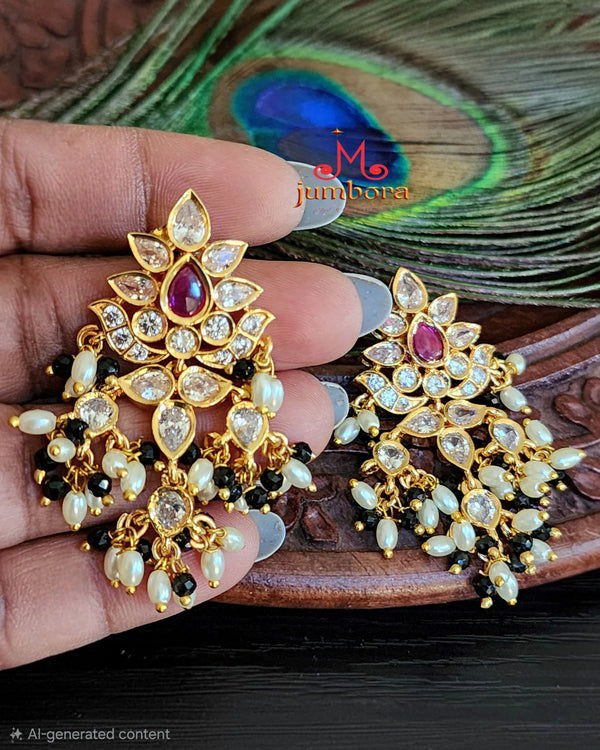 Guttapusalu Style White CZ (Zircon) AD Earrings with Black crystals & Rice Pearls On model’s hand for sizing and scaling