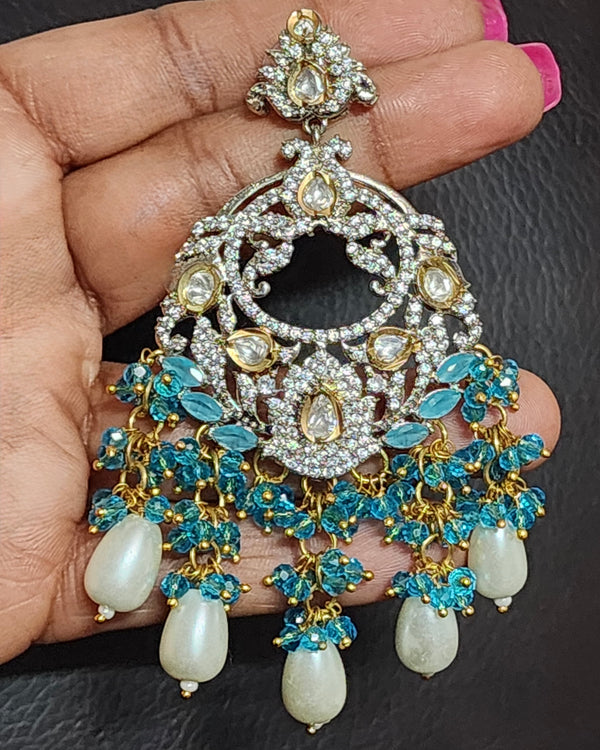 Kundan CZ (Zircon) AD Statement Earrings with Blue Crystal & Pearl Dangle On Model hand for sizing and scaling
