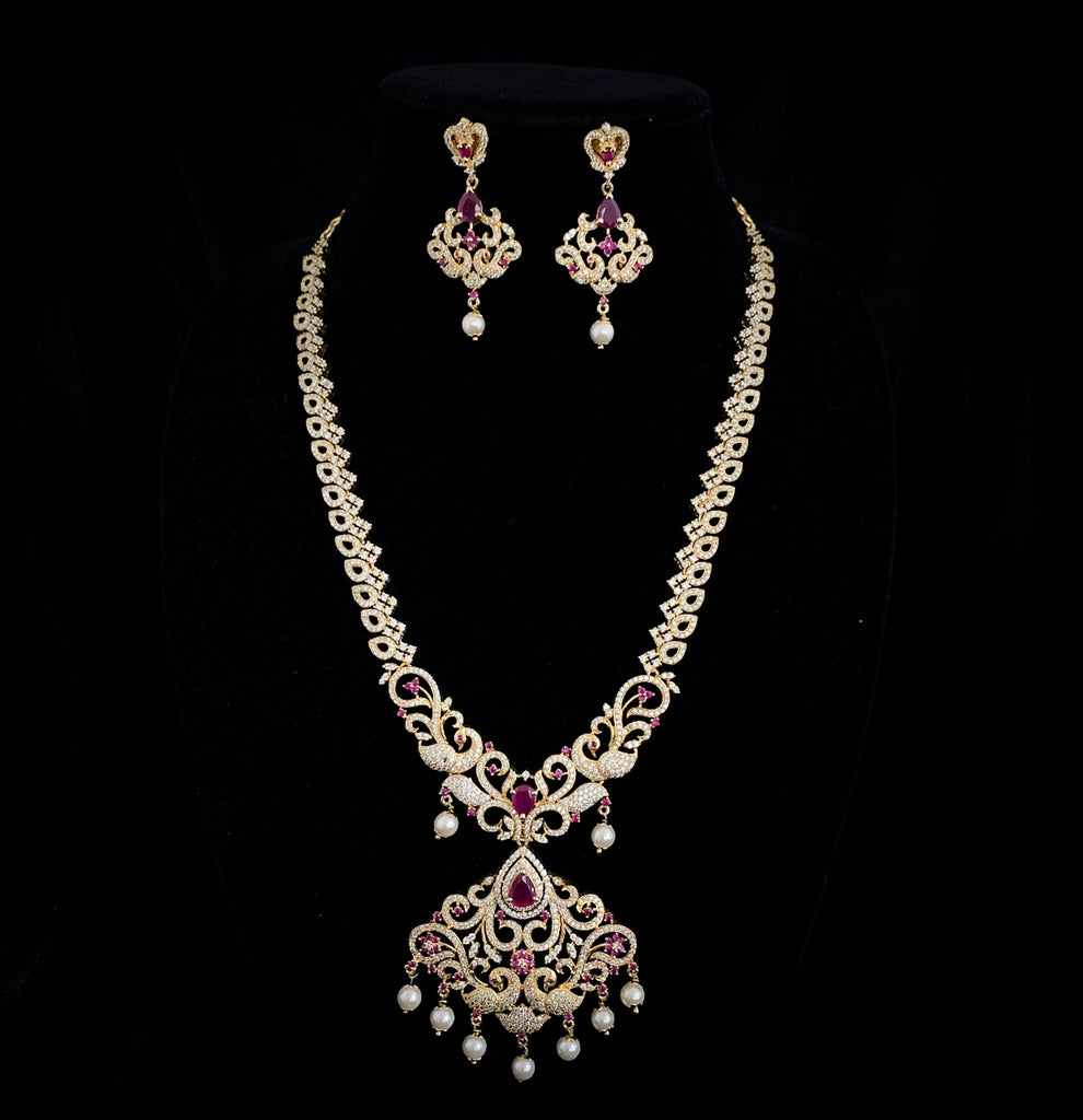 Captivating Peacock Long Zircon Necklace set with Ruby red and white CZ stones
